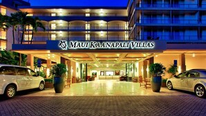 A hotel with a prominent entrance, multiple balconies, and a well-lit facade. - A403 - Spacious 1 Bedroom, 2 King Bed, Garden and Partial Ocean Views (Lahaina)