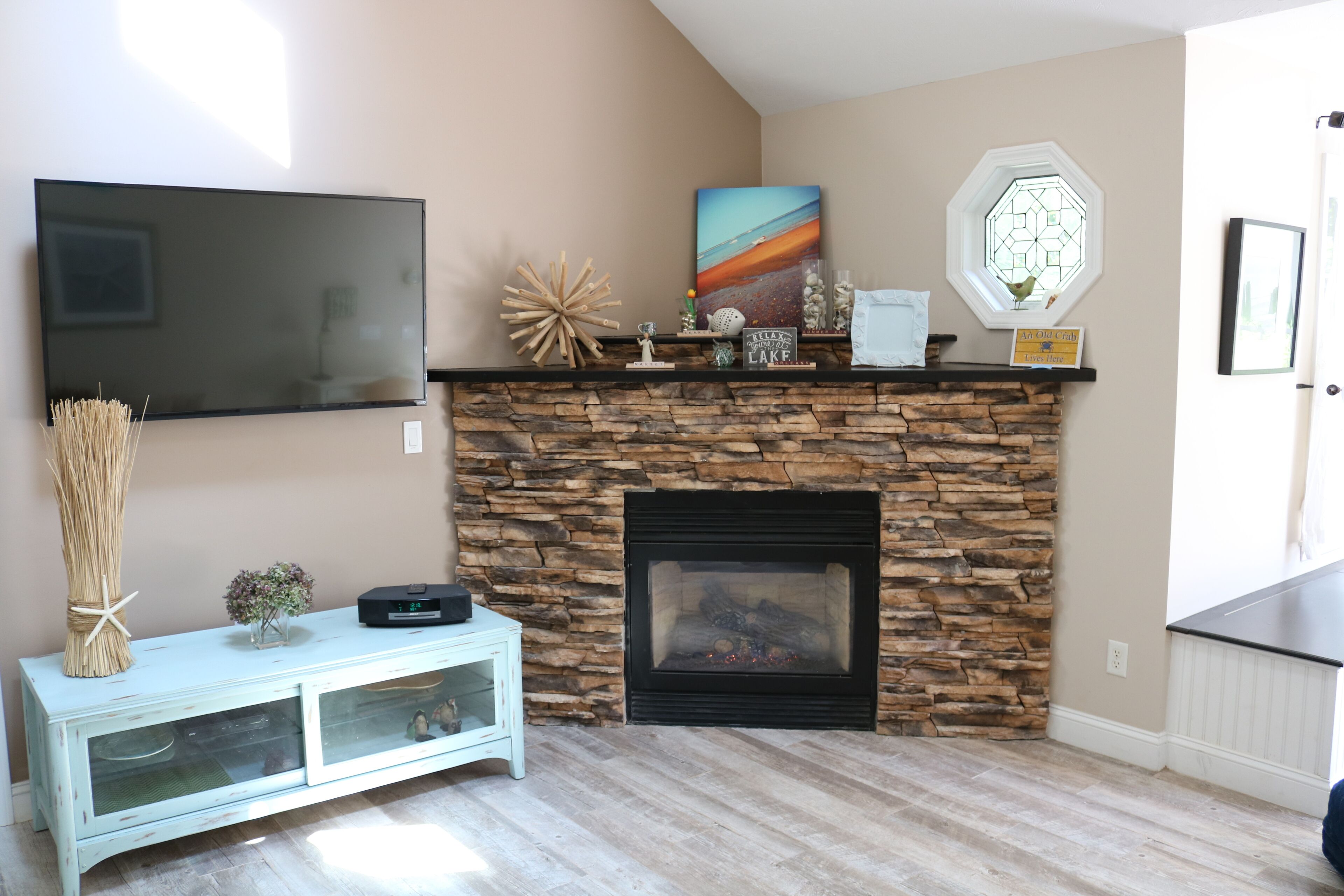 Newly updated open concept  living and entertainment space with gas fireplace. 