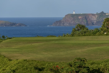 View from lanai across golf course to Kilauea lighthouse