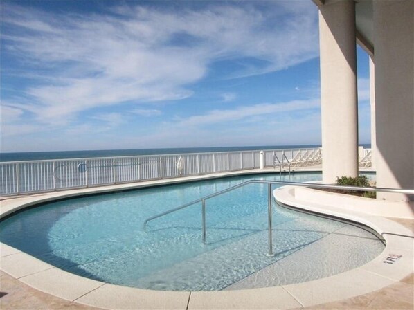 Relax by the ocean with a serene pool overlooking the sea.