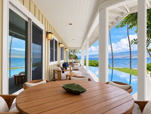 Walk the full length of the covered lanai, dining and lounge seating on one side with the ocean filling the other. - Luxurious Oceanfront Beach House w/AC & Stunning Coastal Views: Puako Bay (74) (Kamuela)