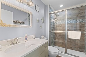 Shower, hair dryer, towels, soap