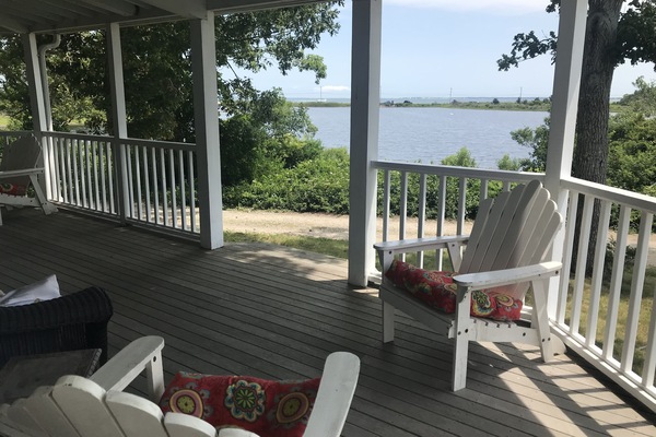 The huge wraparound porch overlooks Farm Pond and Nantucket Sound.