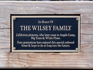 A plaque honoring the Wilsey family, mentioning their history and connection to Angels Camp, Big Trees, and White Pines.