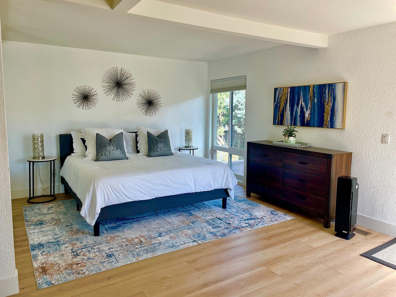 Large downstairs bedroom with generous space and natural light.