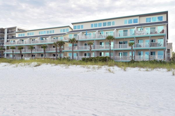 Beach view looking in of Nautical Watch, a nice low-rise community