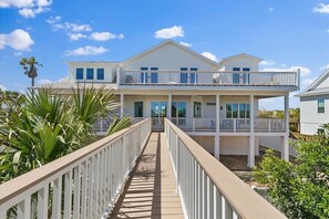 A two-story beachfront house with a covered walkway and balconies. - Seaview Home, Oceanfront Deck & Beach Access (Ponte Vedra Beach)