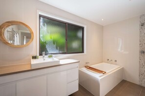 Bathtub, hair dryer, towels