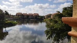 A calm river with buildings in the background. - Beautiful Naples Condo (Naples)
