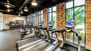 A gym with treadmills, exercise bikes, and a weight area. - New Listing! Festival Resort, 7mi to Disney & 18mi to Universal - FS211016 (Davenport)