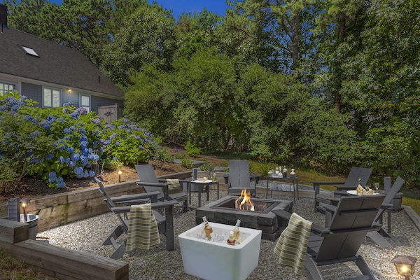 Night view of the outdoor fire pit- Sip and Savor fireside moments.