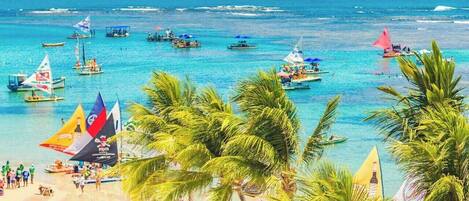 On the beach, sun-loungers, beach towels
