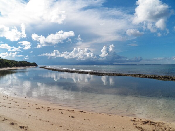 On the beach, sun loungers, beach towels