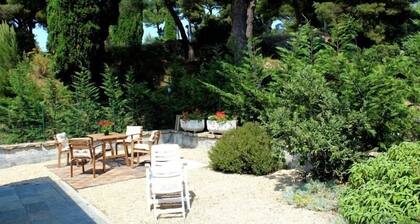 an island of peace with amazing sea wiew, among palms, pines, and olive trees