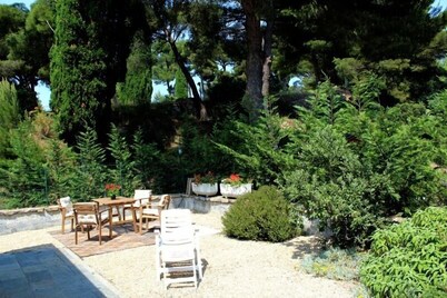 an island of peace with amazing sea wiew, among palms, pines, and olive trees 