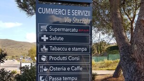 A sign for 'Belgodere balagna' with a list of services including a supermarket, pharmacy, tobacco, coffee, and beauty salon. - Quiet 500 m from Lozari beach (Palasca)