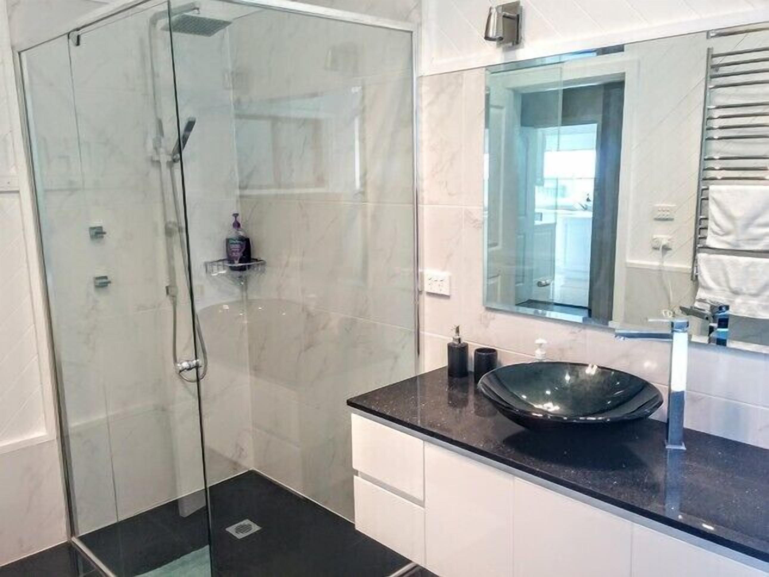 Bathtub, hair dryer, towels, soap