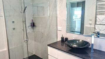Bathtub, hair dryer, towels, soap