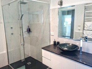 Bathtub, hair dryer, towels, soap