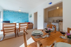 12 Westward Flats, Polzeath. First floor: Open-plan living area with access to kitchen