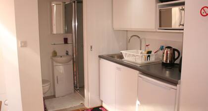 Self-contained New Studio with independent entrance in an up-market quiet area.