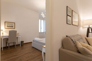 1 bedroom, desk, iron/ironing board, travel crib