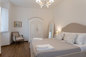 1 bedroom, desk, iron/ironing board, travel crib