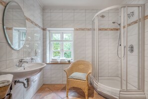 Bathtub, hair dryer, towels, soap