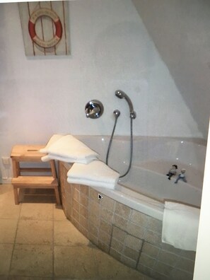 Bathtub, hair dryer, towels