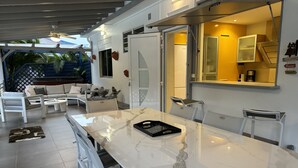 A modern kitchen with a large marble countertop, white cabinetry, and a built-in oven. - BEAUTIFUL COUNTRY PROPERTY WITH PRIVATE POOL. HOLIDAYS TO YOU! (SAINTE ANNE)