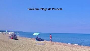 On the beach, sun-loungers