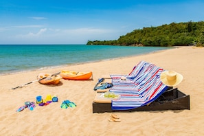 On the beach, sun-loungers, beach towels