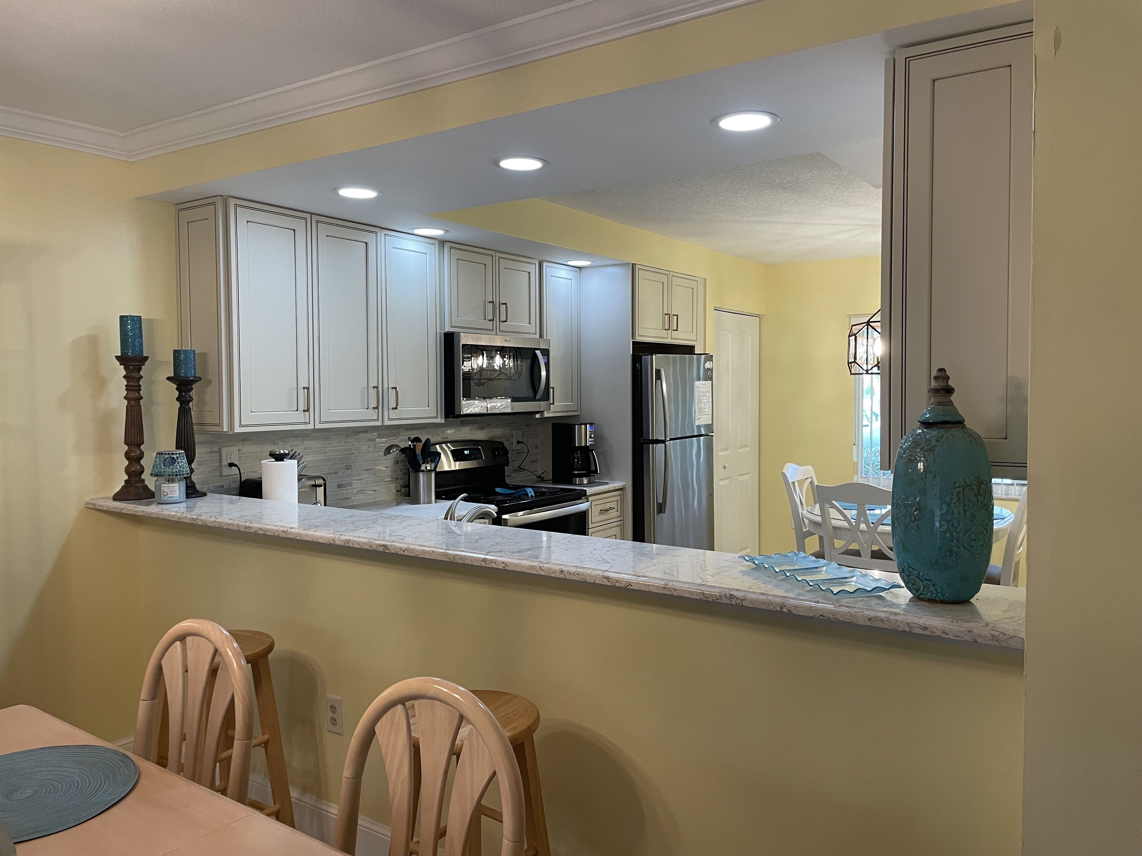 View into kitchen from dining area.