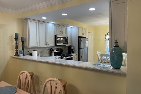 View into kitchen from dining area.