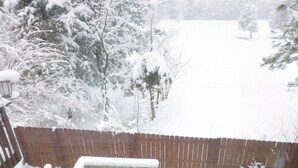 A snow-covered outdoor area with a wooden fence and a white railing. - Oaks at Wasatch--call for discounted monthly off-season corporate rates (Cottonwood Heights)