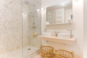 Bathtub, hair dryer, towels, soap