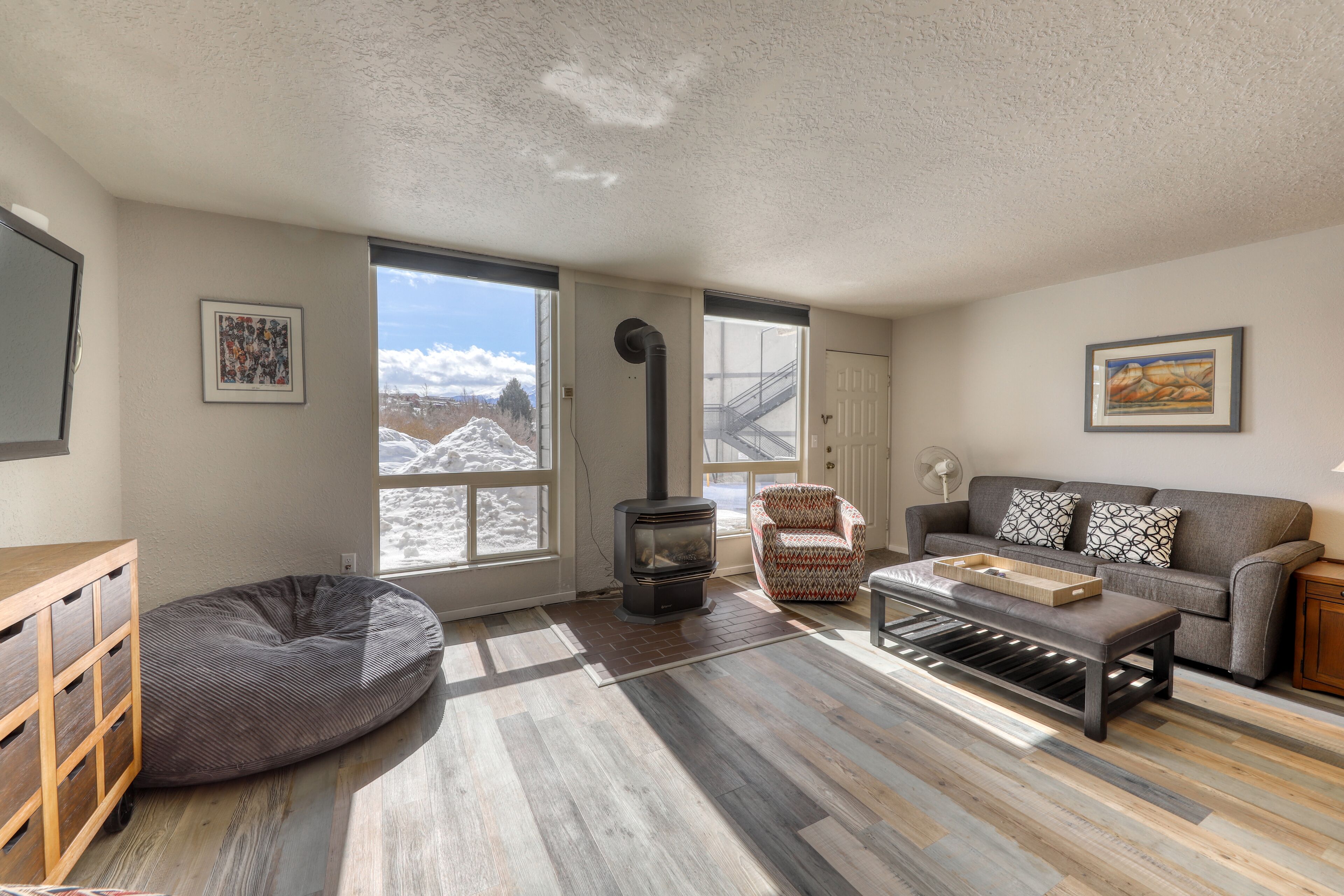 Updated creekside condo with private sauna, patio, mountain views & free WiFi