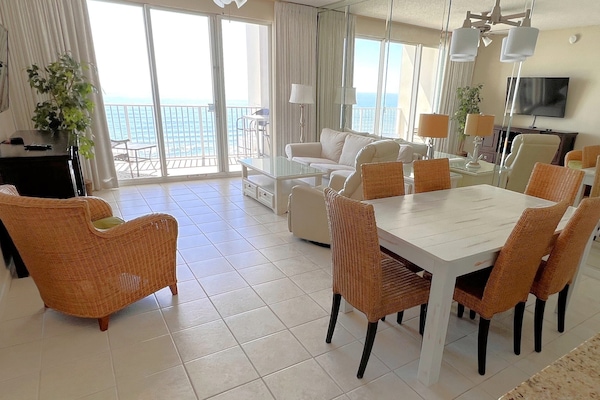 Endless water views from living, dining, kitchen. Slipcovered sofa. Roku 55 TV.