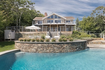 Gorgeous moon shaped pool with waterfall spa
