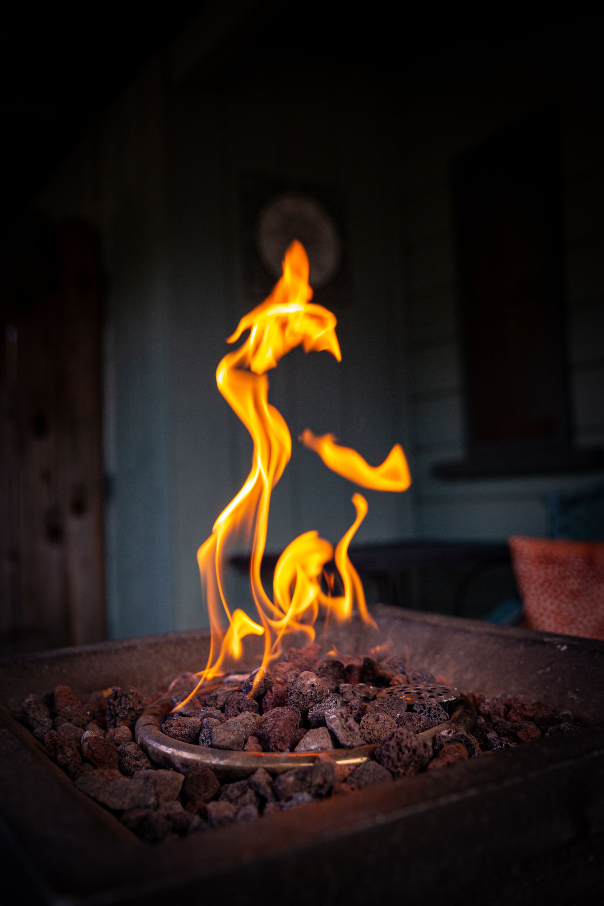 A close-up of a charcoal grill with flames.