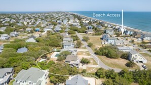 An aerial view of a residential area with a beach access point marked by a white line. - 4 Bedroom in Duck - Almost Oceanfront - Awesome views
 (Duck)