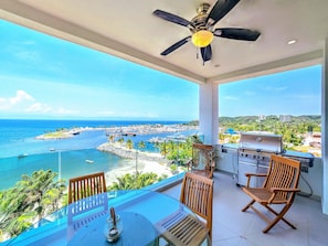 Great room terrace with grill and marina in background