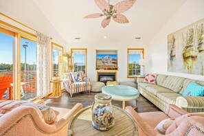 Flat-screen TV, DVD player, foosball, books