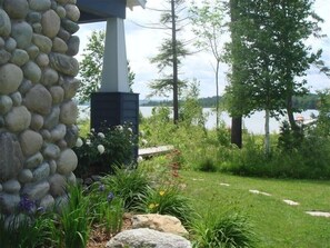 Surrounded by lush gardens and a serene lake, this tranquil outdoor space offers a peaceful retreat.