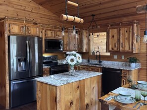 Fridge, microwave, oven, stovetop - Luxury Riverfront Home w/ Fireplace, Cargo Lift, Kayaks, Firewood, Fenced Area (Everett)