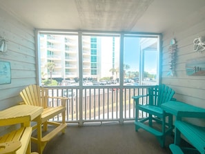 Enjoy a view of the surrounding area from the comfort of your room, which features a table and two chairs.
