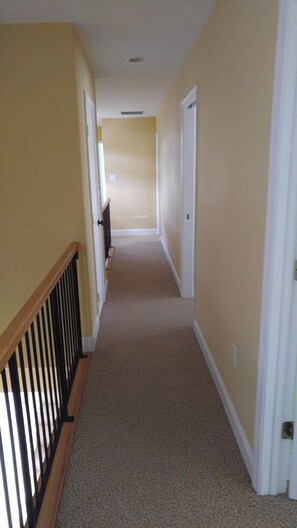 Stroll down this serene hallway to a door.