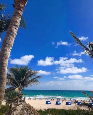 On the beach, sun loungers, beach towels