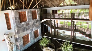 A room with a stone wall, wooden shutters, a staircase, and a view of a garden. - ...casaemelina-puertoescondido...contact us for a deal !
25m Pool, huge property (Puerto Escondido)