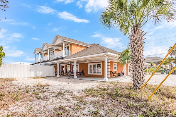View of home with 3 balconies, private saltwater pool and 1 of 2 parking areas.